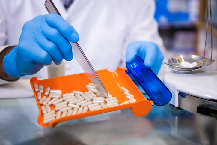 Pharmacist counting pills