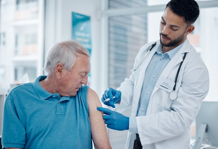 Pharmacist giving vaccines