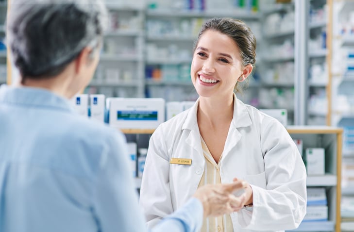 Pharmacist working clinical opportunity with patient