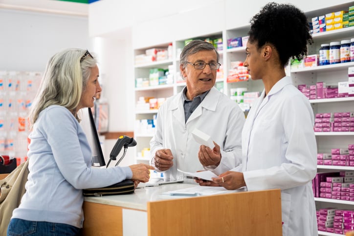 Pharmacists providing patient consultation.